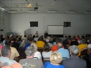 Stan (left) being introduced by Ron Struble to speak at the 2013 Kecksburg UFO Conference at the annual festival.